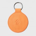 Porte clés vintage en cuir orange et blanc numéroté
