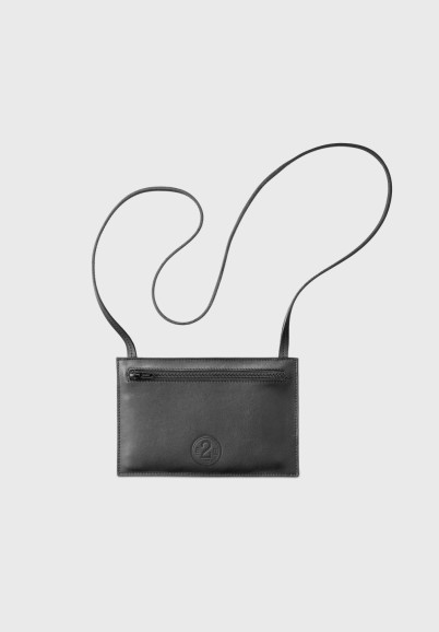 Travel pouch with shoulder strap in recycled black leather