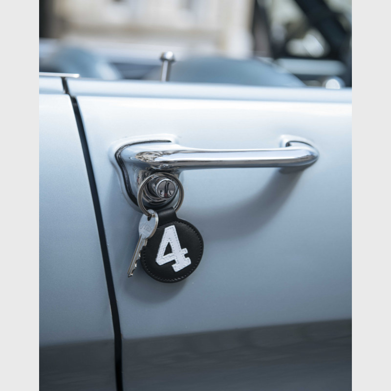 Porte clés luxe en cuir noir et blanc numéroté - E2R